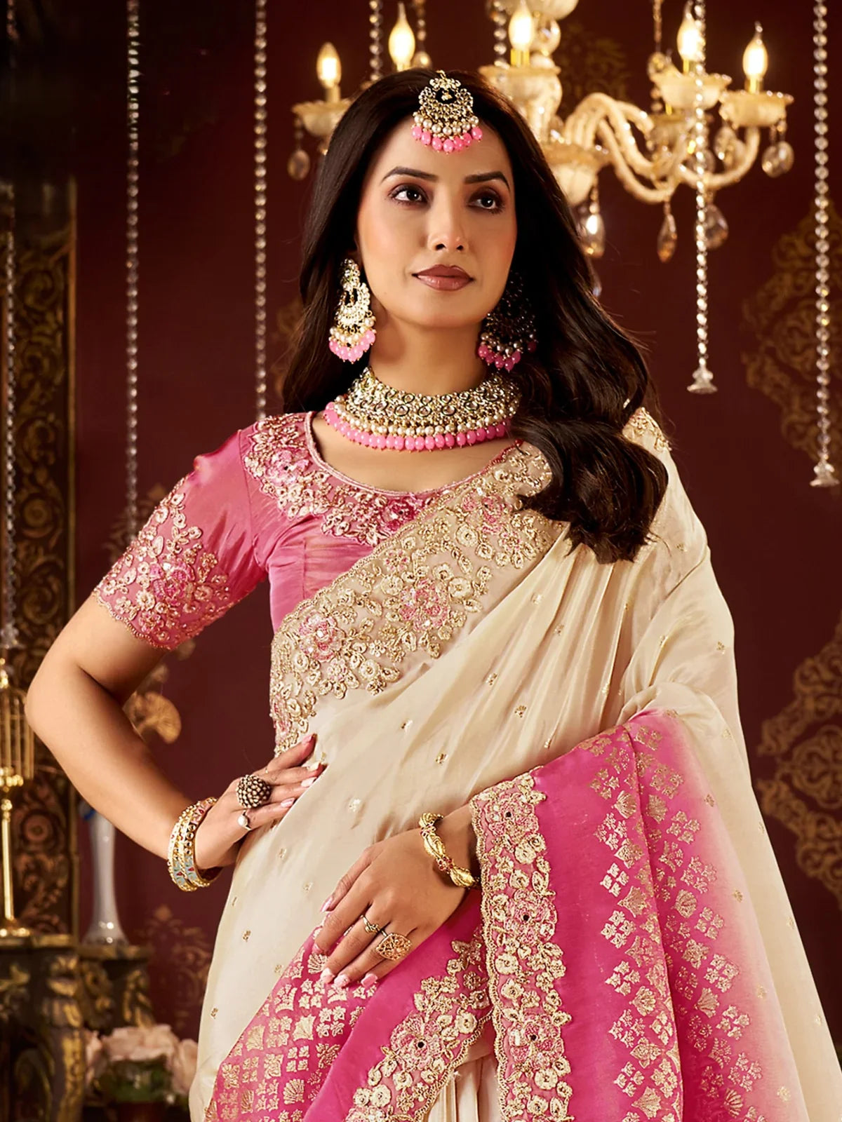 Tarani closeup view of embroidered blouse and zari border on pink and cream silk saree for festive occasions