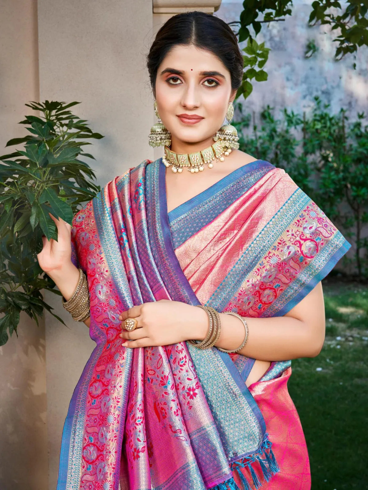 Tarani festive kanjivaram saree upper body view with pink and gold woven pallu