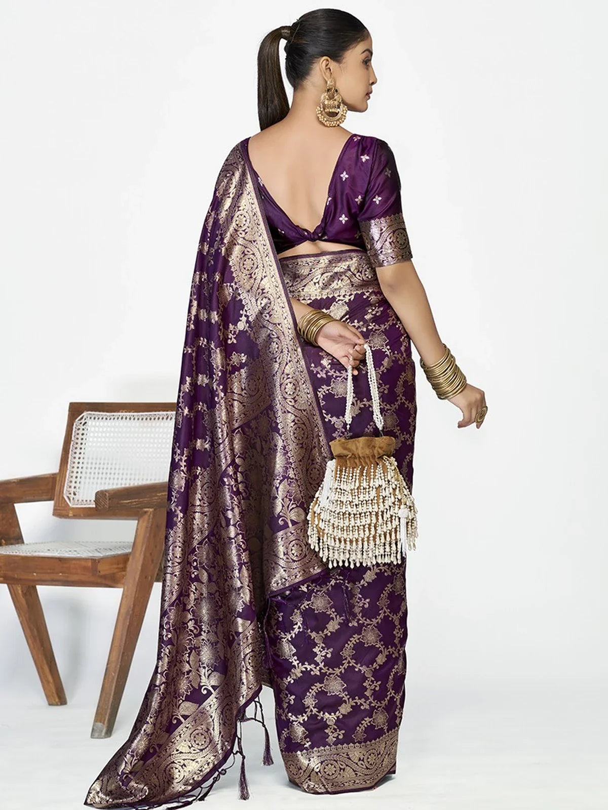 Tarani purple silk saree back view showing open blouse design and elegant drape