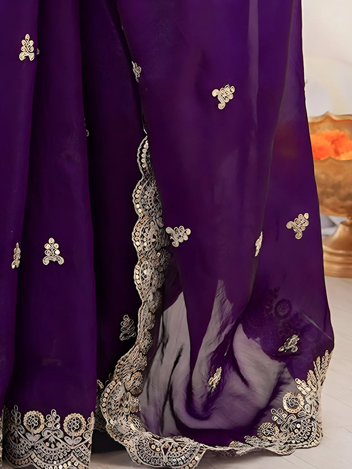 Tarani purple saree closeup showing sequin embroidery motifs and cutwork border details
