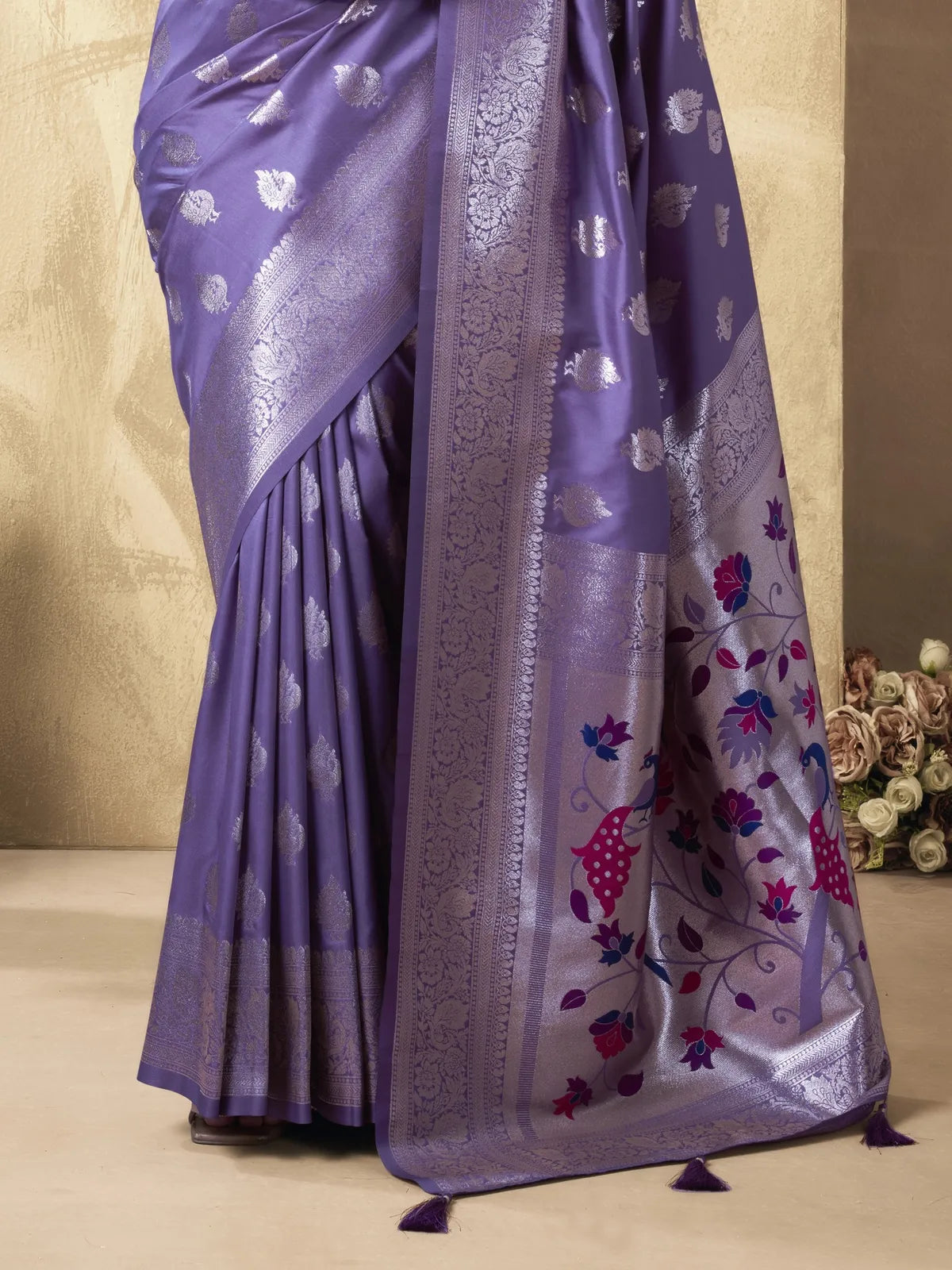 Tarani purple silk saree closeup view with zari detailing and floral motifs