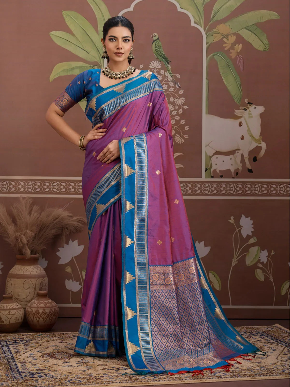 Tarani purple silk saree with golden zari border and blue blouse, perfect for festive and party wear