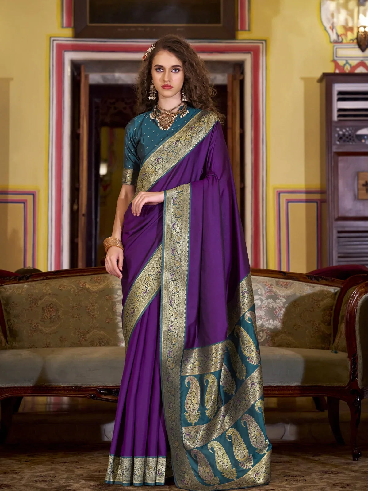 Tarani purple silk saree full view with golden border and teal pallu for festive wear
