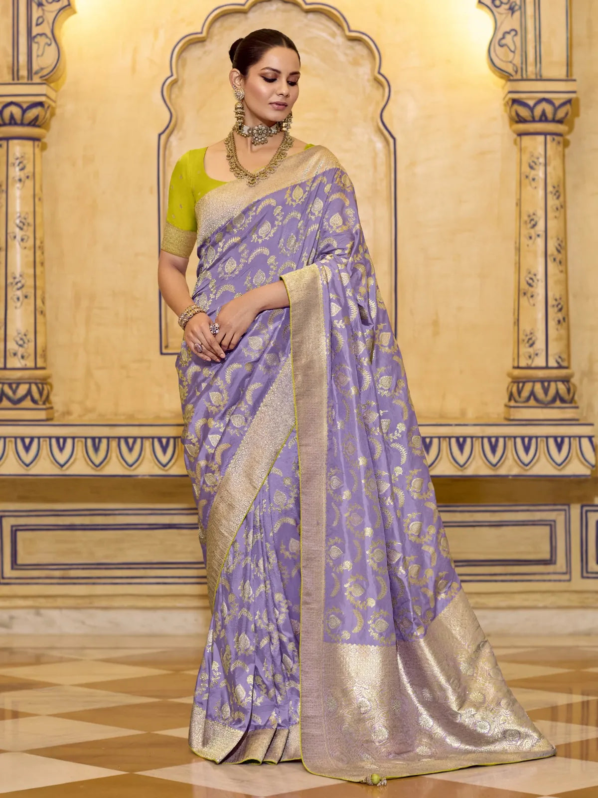 Tarani premium purple crepe silk saree with golden zari work and lime green blouse front full view