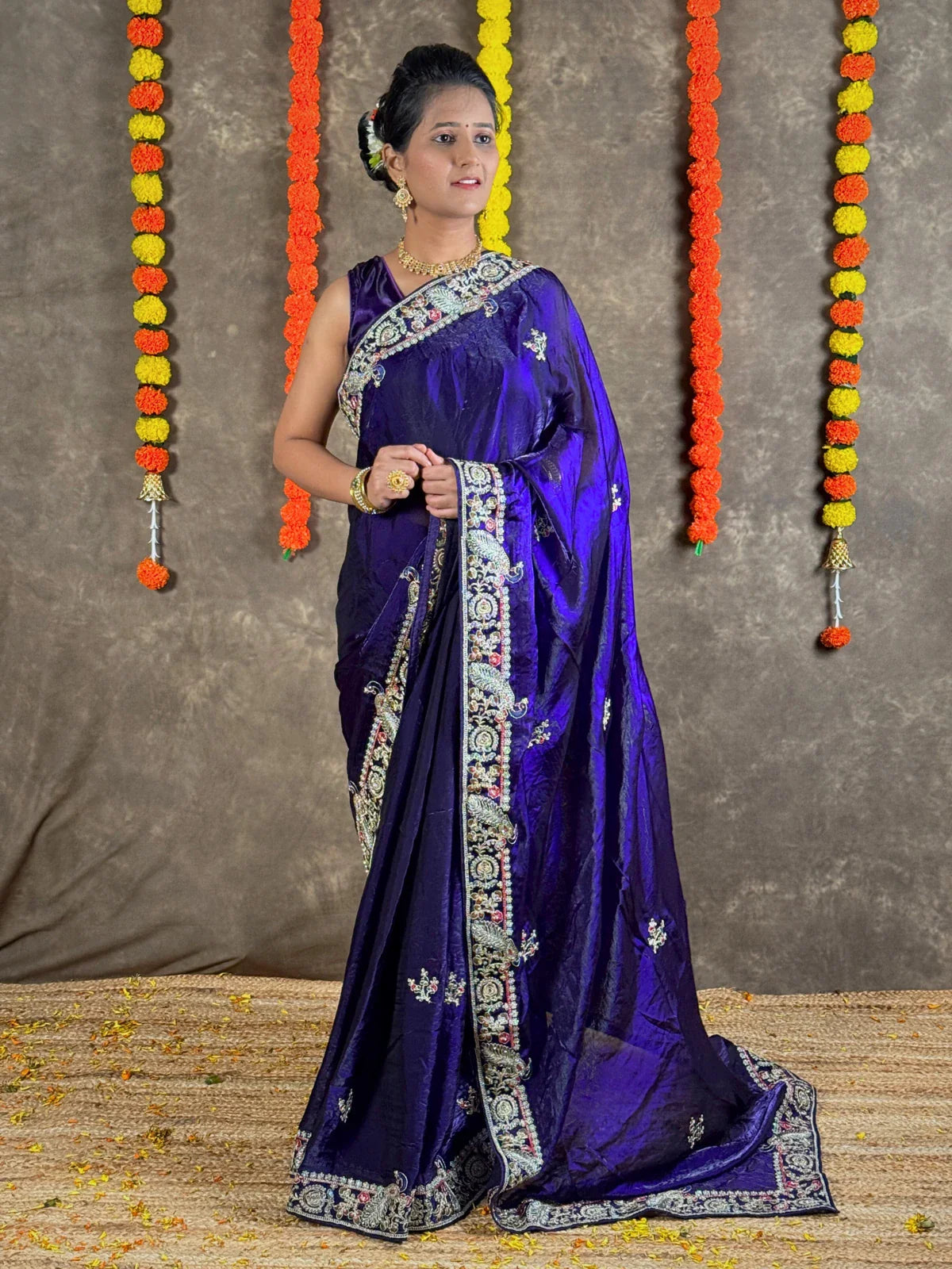 Tarani premium purple silk saree full view with elegant embroidery border and festive appeal