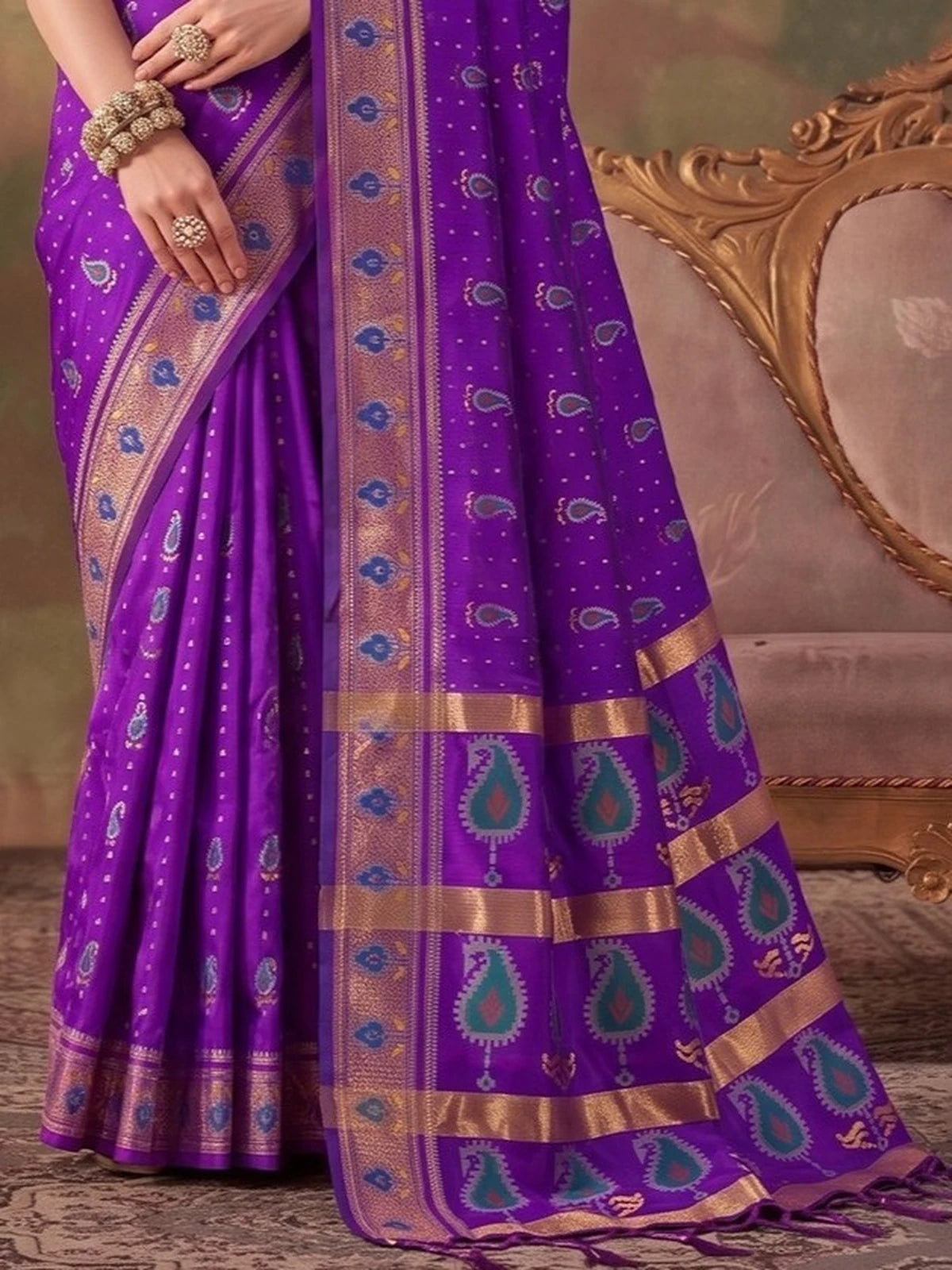 Tarani purple silk saree pallu close view showing zari weaving and border