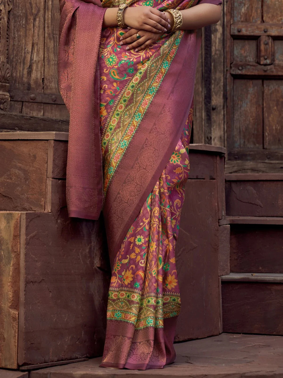 Tarani purple silk saree closeup showing intricate floral pallu and zari detailing