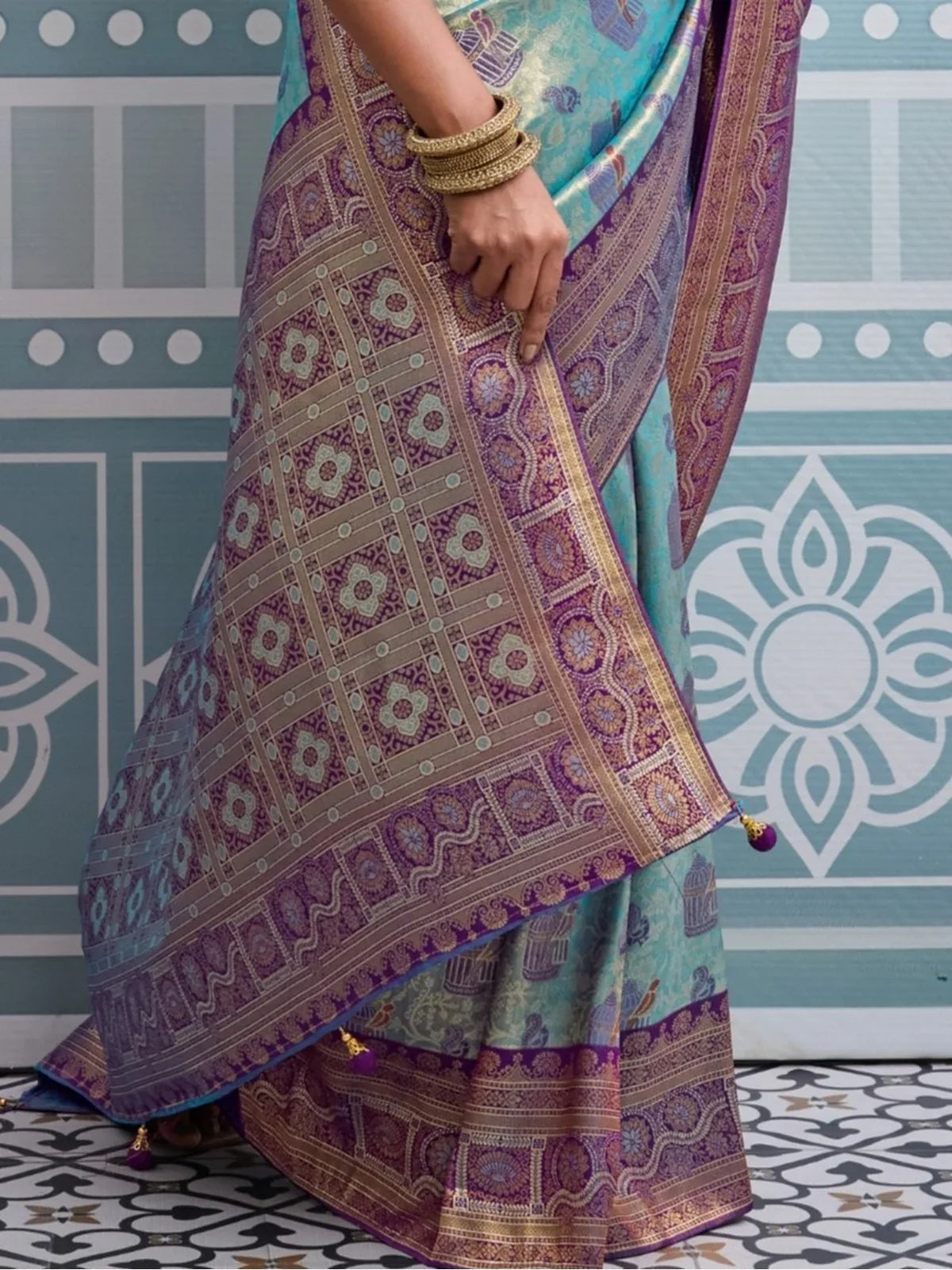 Tarani purple silk saree pallu close view highlighting zari thread and meenakari details