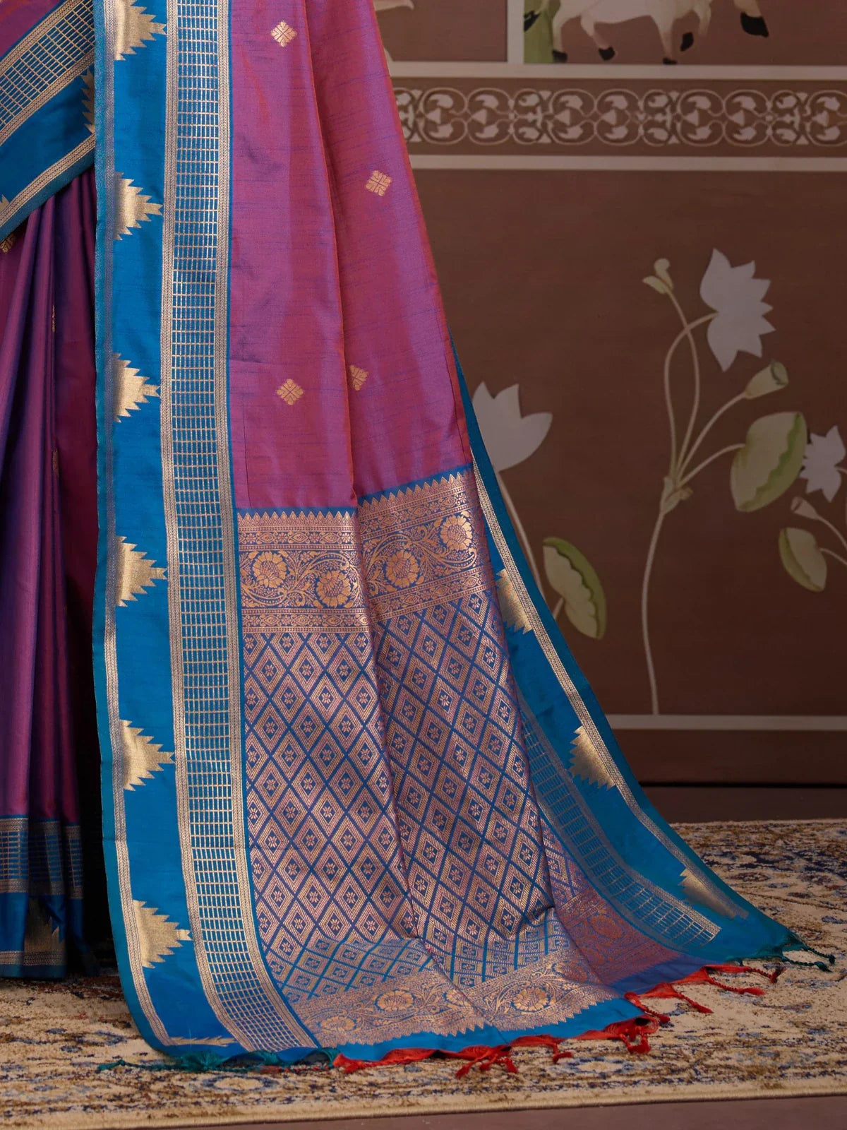 Tarani purple silk saree with golden zari woven pallu and temple border detailing