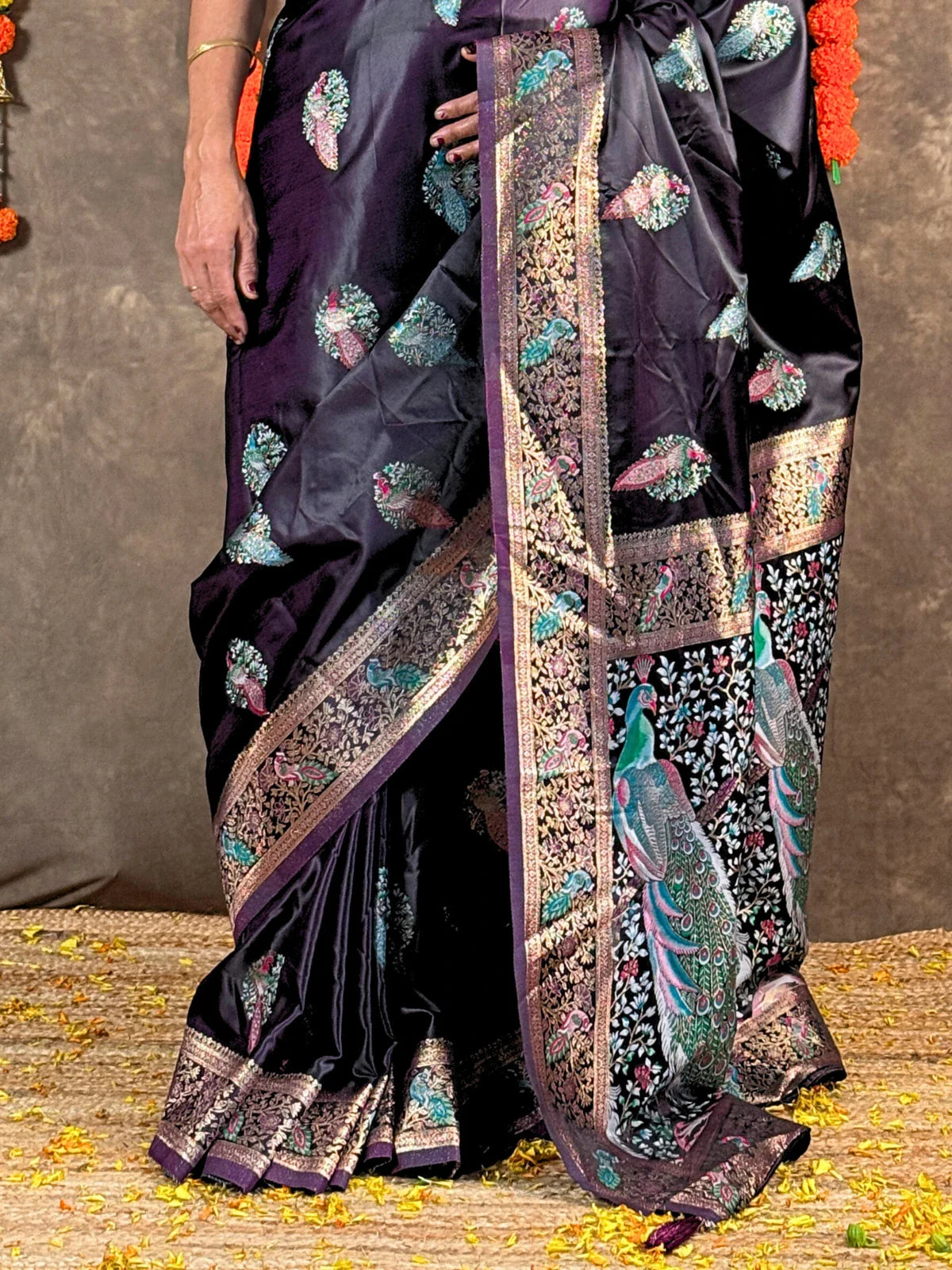 Tarani purple silk saree pallu showing intricate peacock border and zari work