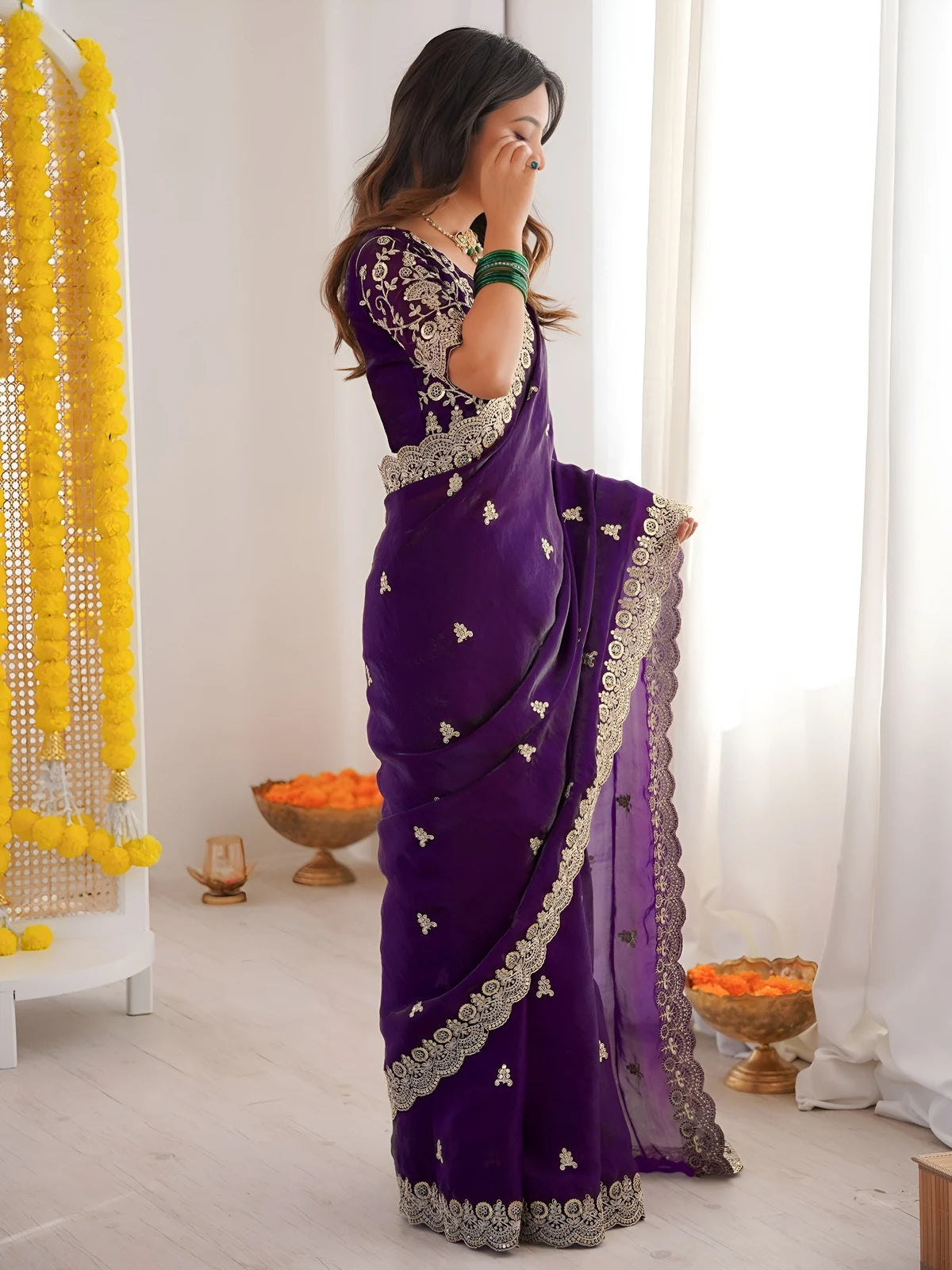 Tarani purple saree side view showing cutwork border and sequin embroidery details