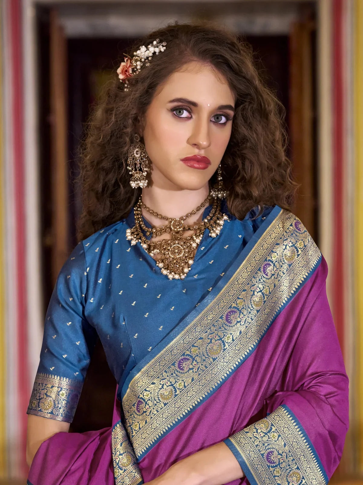 Tarani purple silk saree upper body view with blue blouse and golden zari border