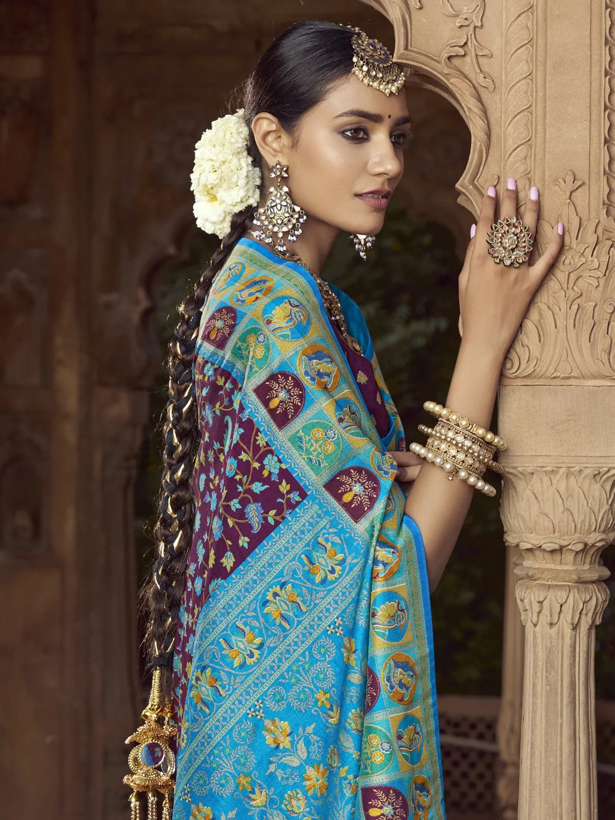 Tarani purple silk saree close upper-body view with golden jewellery styling