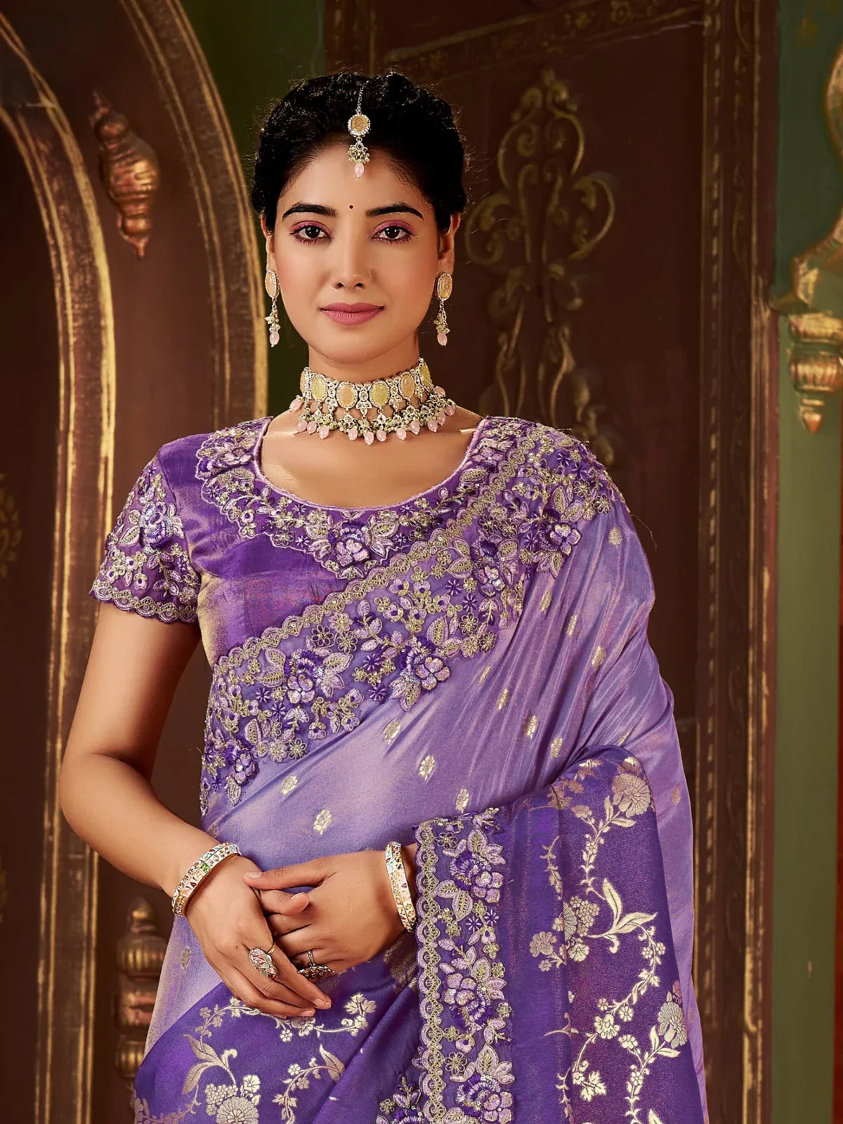 Tarani purple silk saree blouse close-up with floral embroidery and jewelry styling