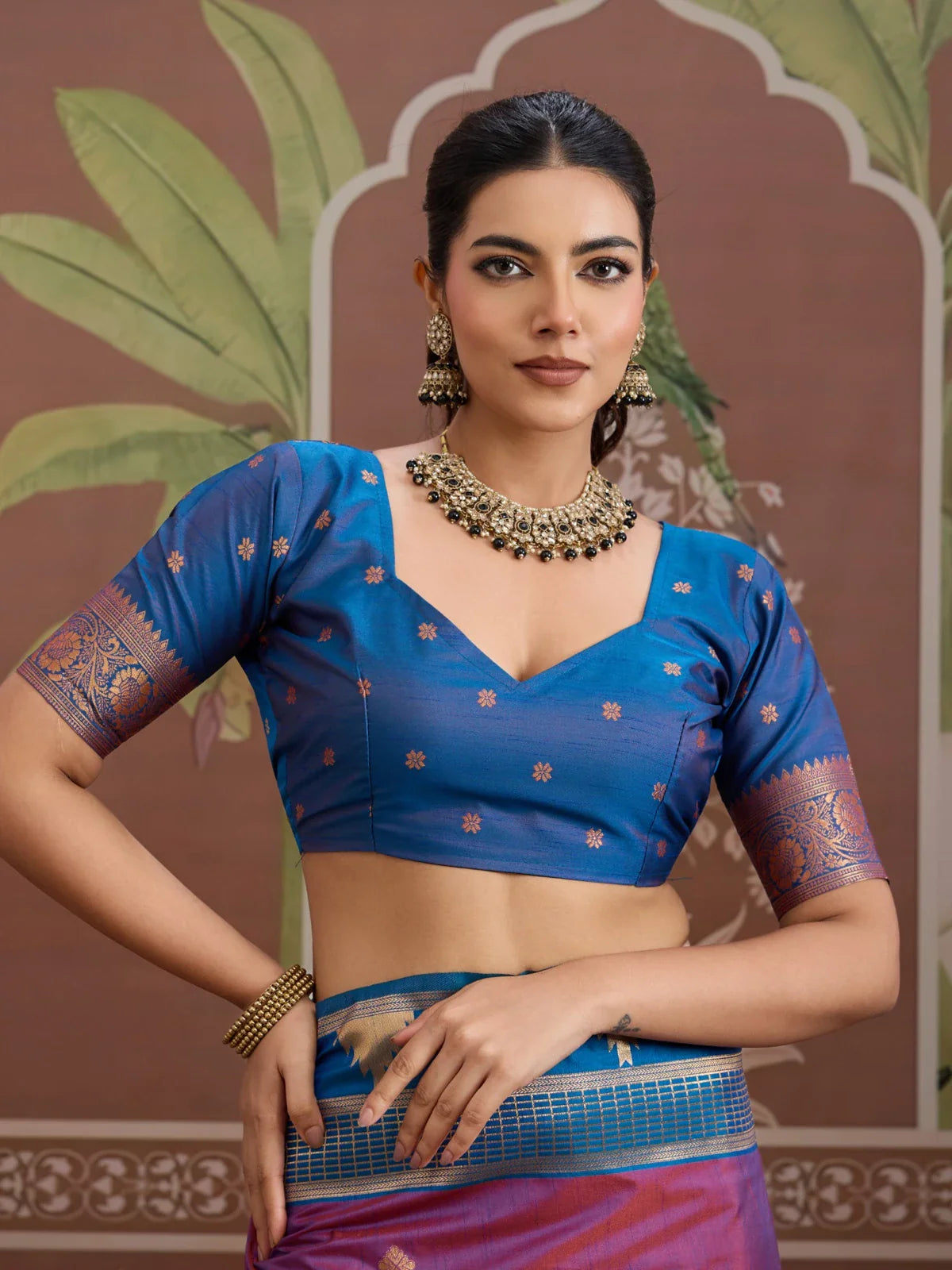 Tarani blue contrast blouse with elbow sleeve and V-neck style for silk saree
