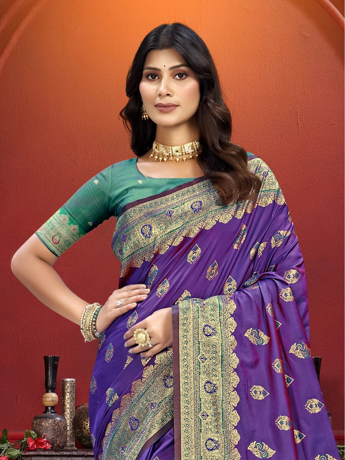 Tarani purple silk saree upper body view with elegant green blouse and golden jewellery