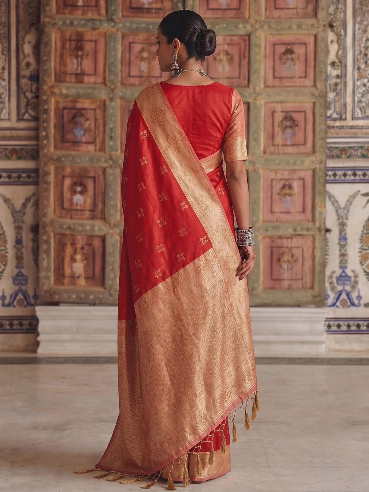 Tarani premium soft silk red saree with contrast woven border back view