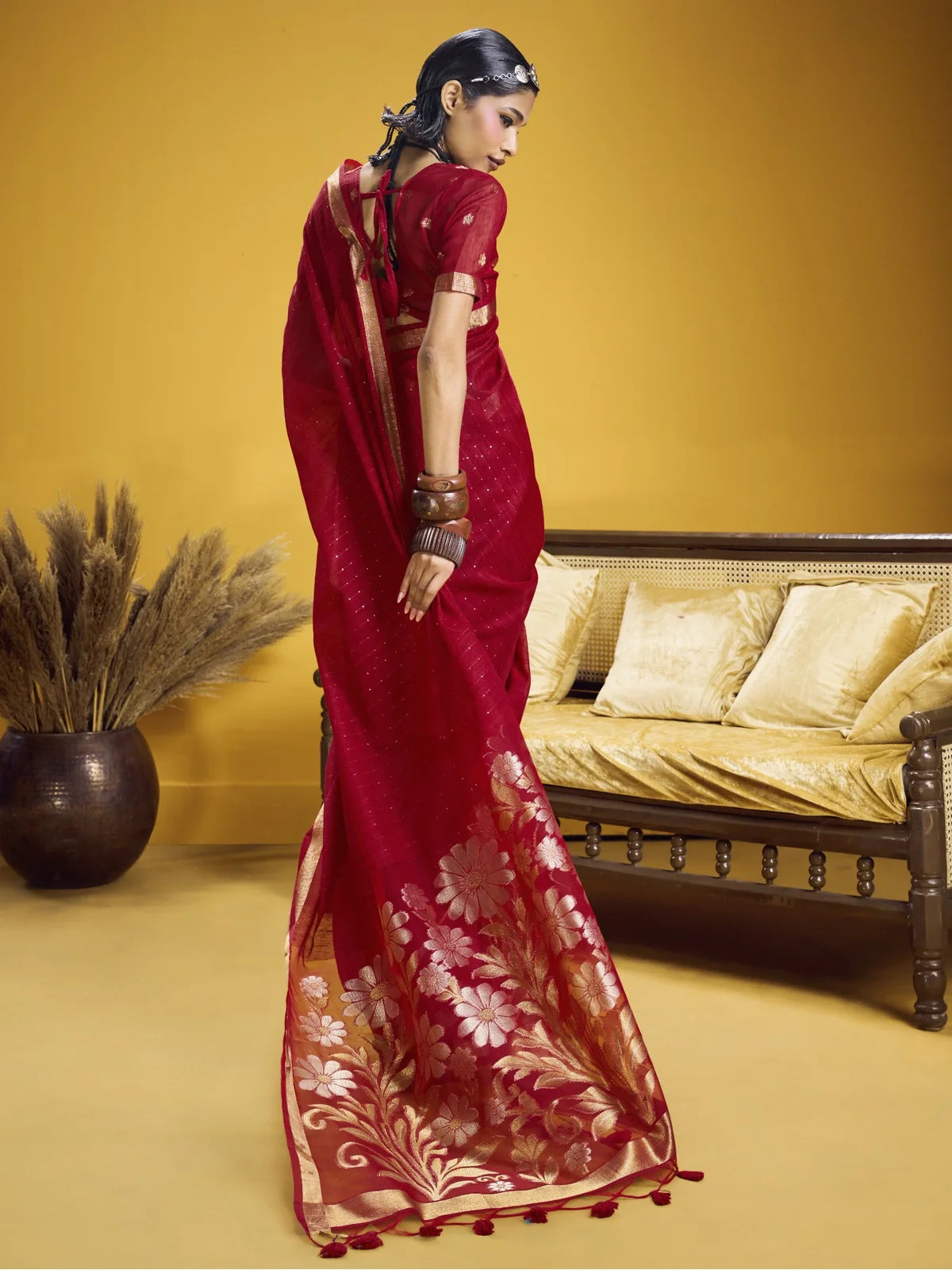 Tarani back view of red saree showing elegant blouse and pallu fall