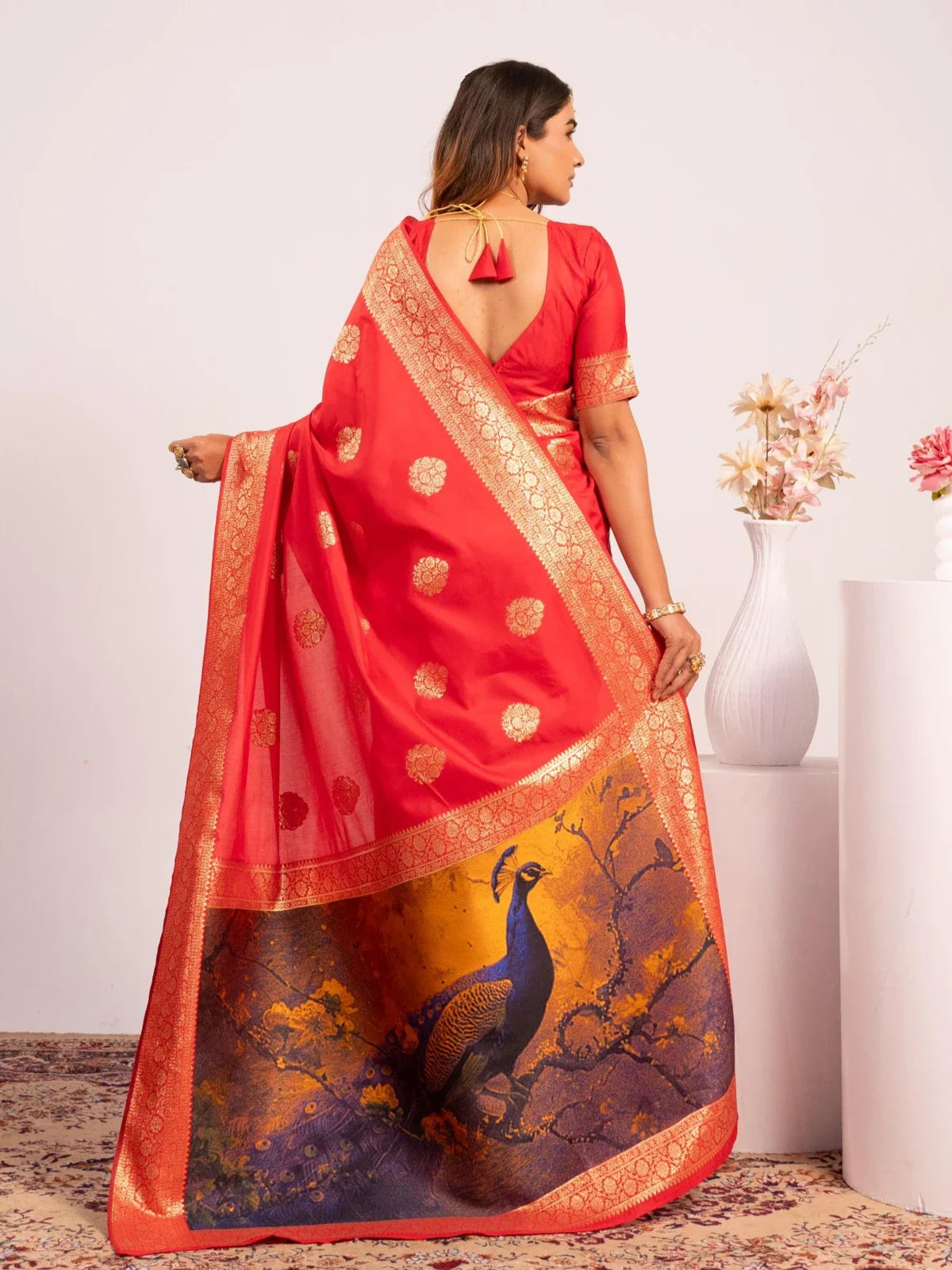 Tarani red banarasi silk saree back view with rich peacock pallu and zari border drape