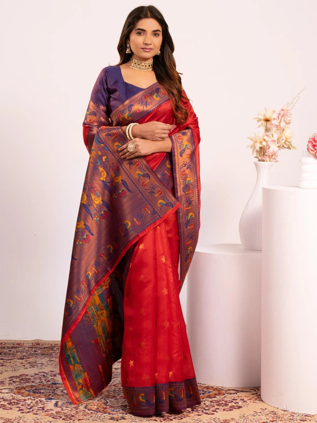 Tarani red Paithani saree front view highlighting zari woven pallu and floral butties