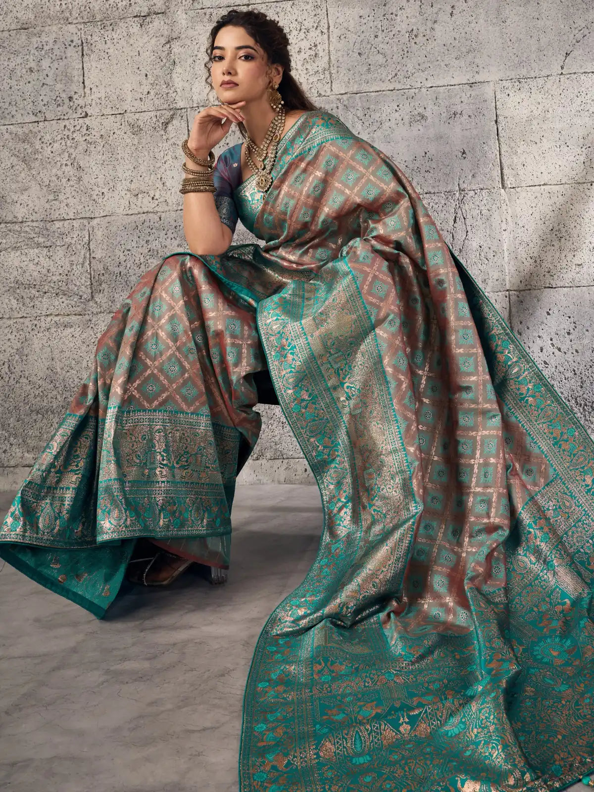 Tarani teal Banarasi silk saree front view highlighting zari motifs