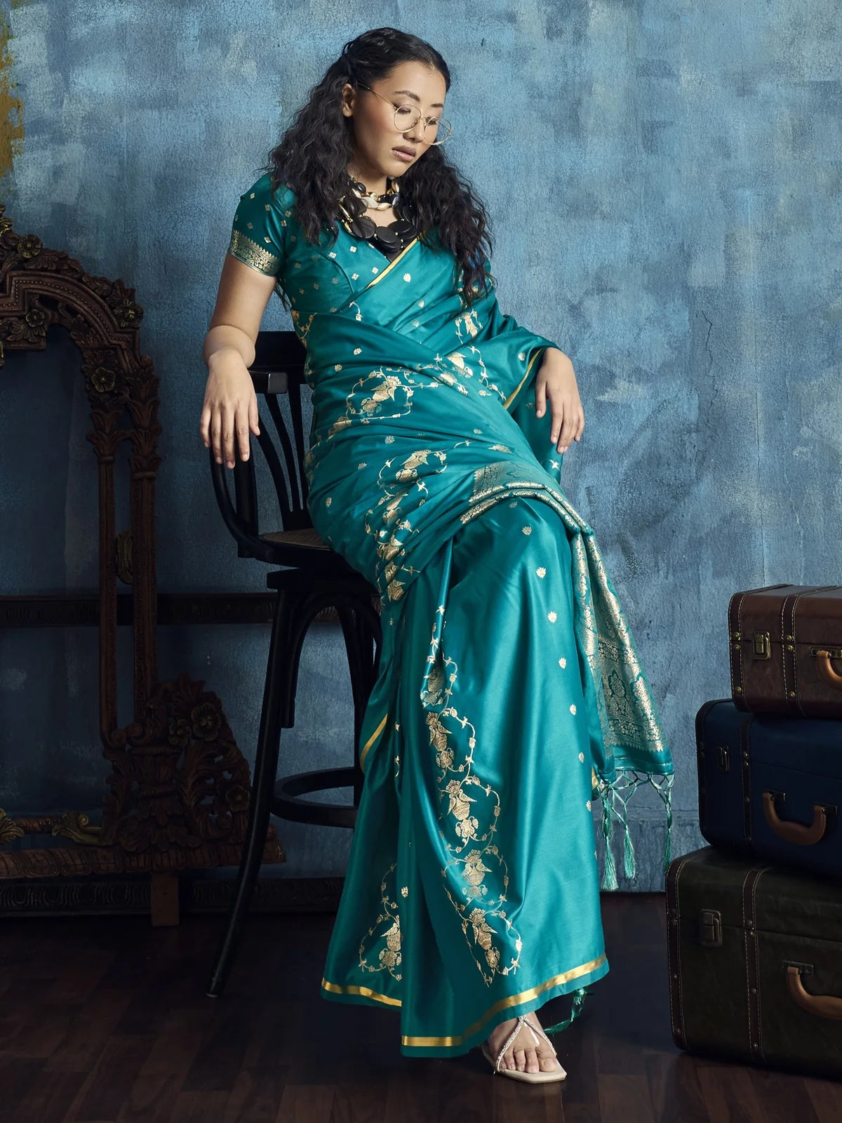 Tarani Dayita teal pure satin saree front view with elegant handloom weaving and zari floral design