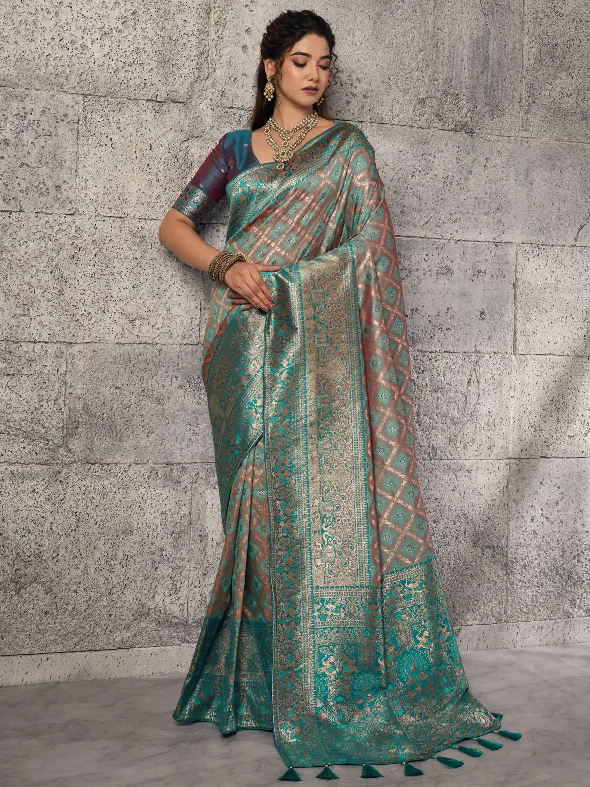 Tarani teal Banarasi silk saree full view with contrast blouse and grand zari border