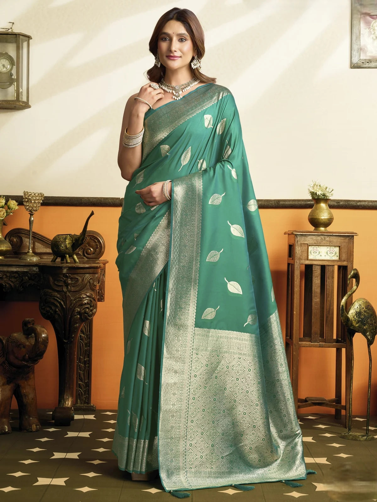 Tarani Sangita teal soft silk saree full view with silver zari leaf motifs, woven border and tassels