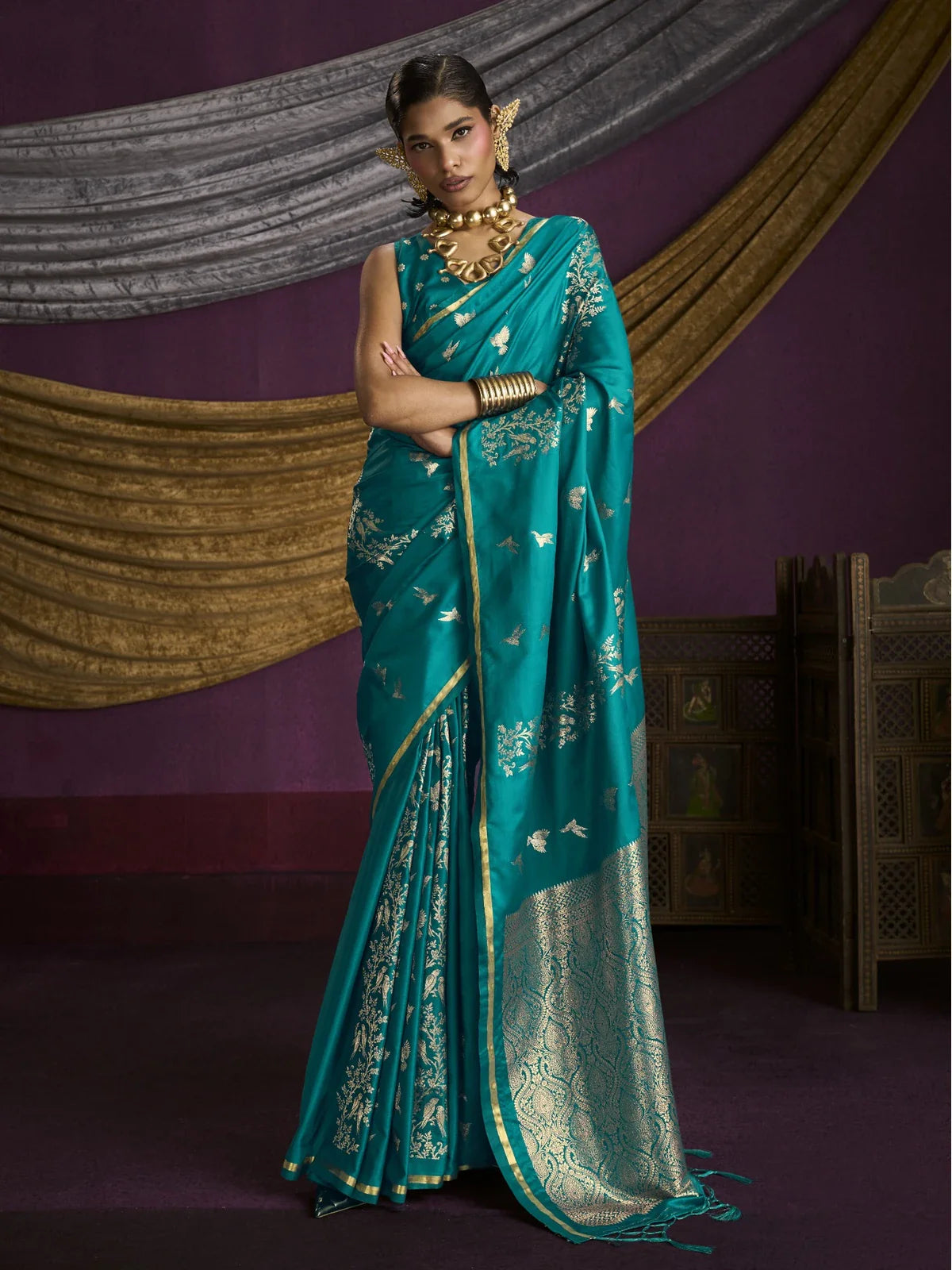 Tarani teal satin weaving silk saree full view with golden motifs and zari pallu