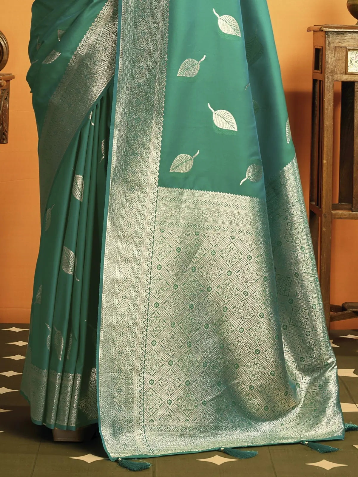 Tarani Sangita teal soft silk saree pallu view with silver zari weaving, leaf motifs and tassels