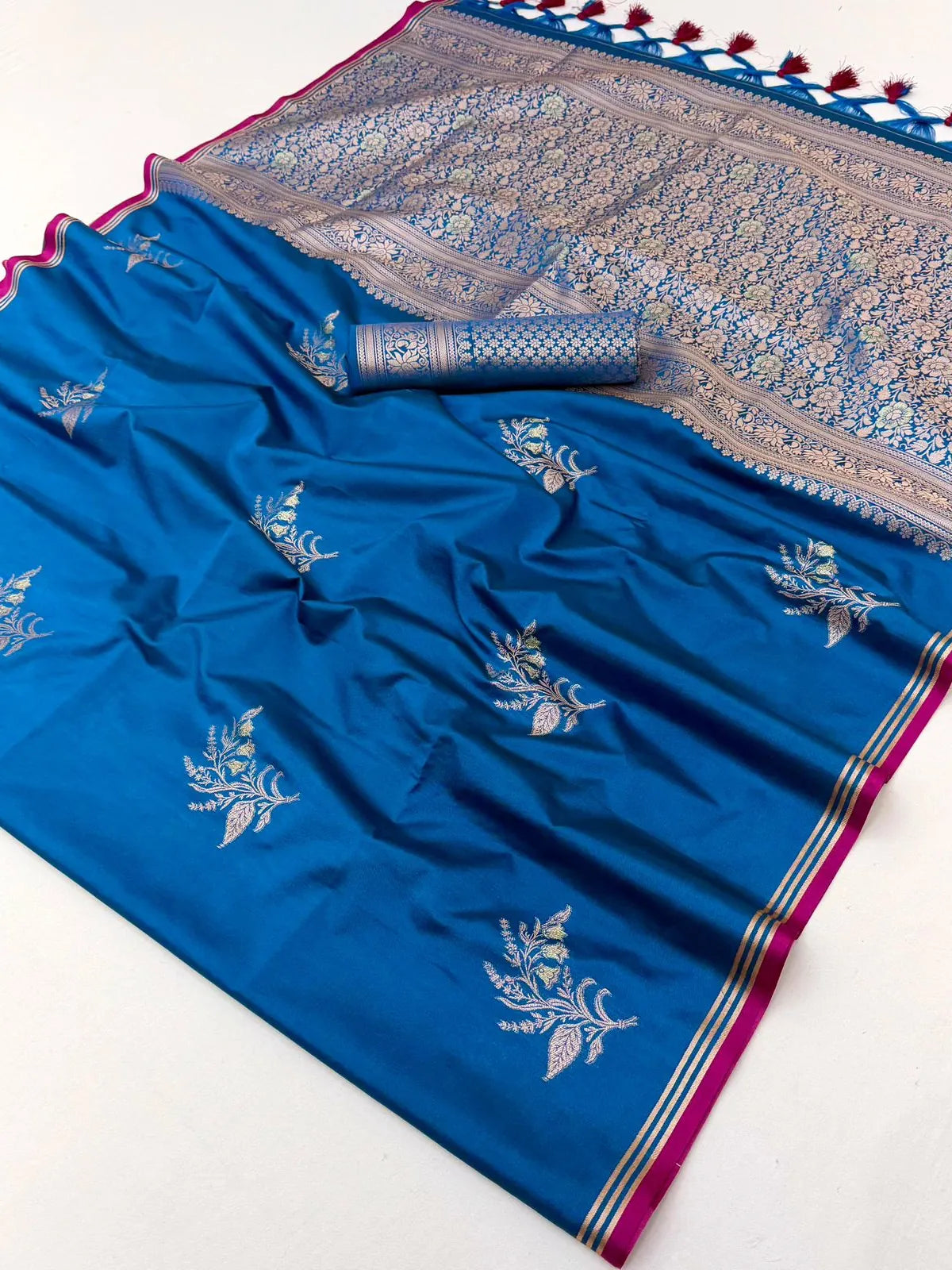 Tarani teal party wear silk saree pallu view with woven floral zari craftsmanship