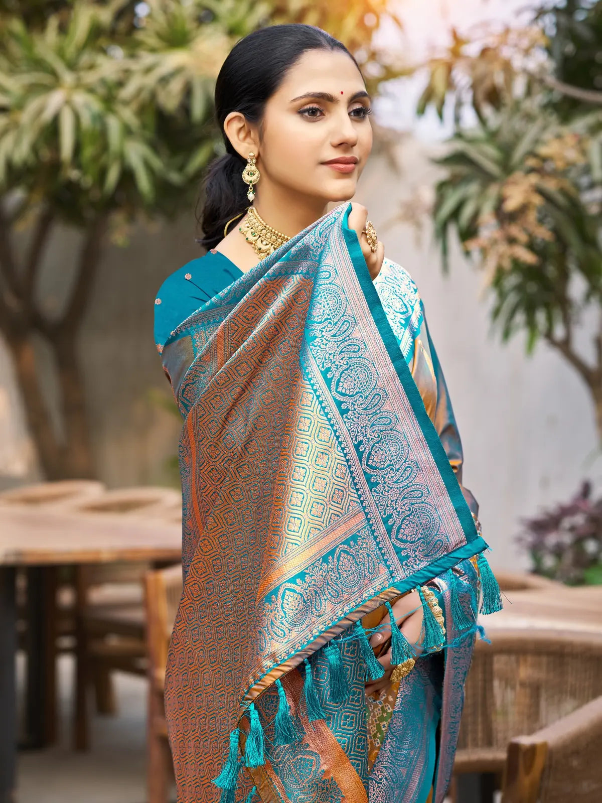 Tarani teal soft silk saree upper body view with woven pallu and zari detailing