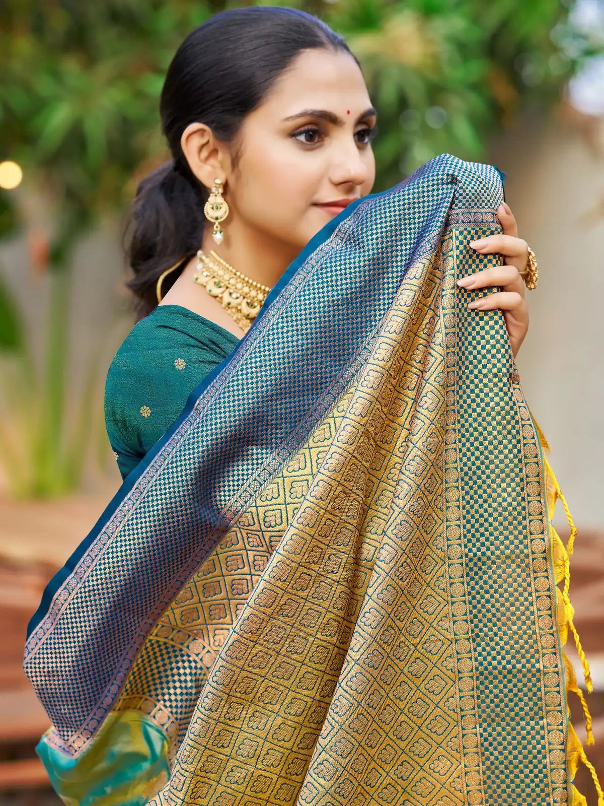 Tarani teal soft silk saree upper body view with rich woven pallu and contrast blouse