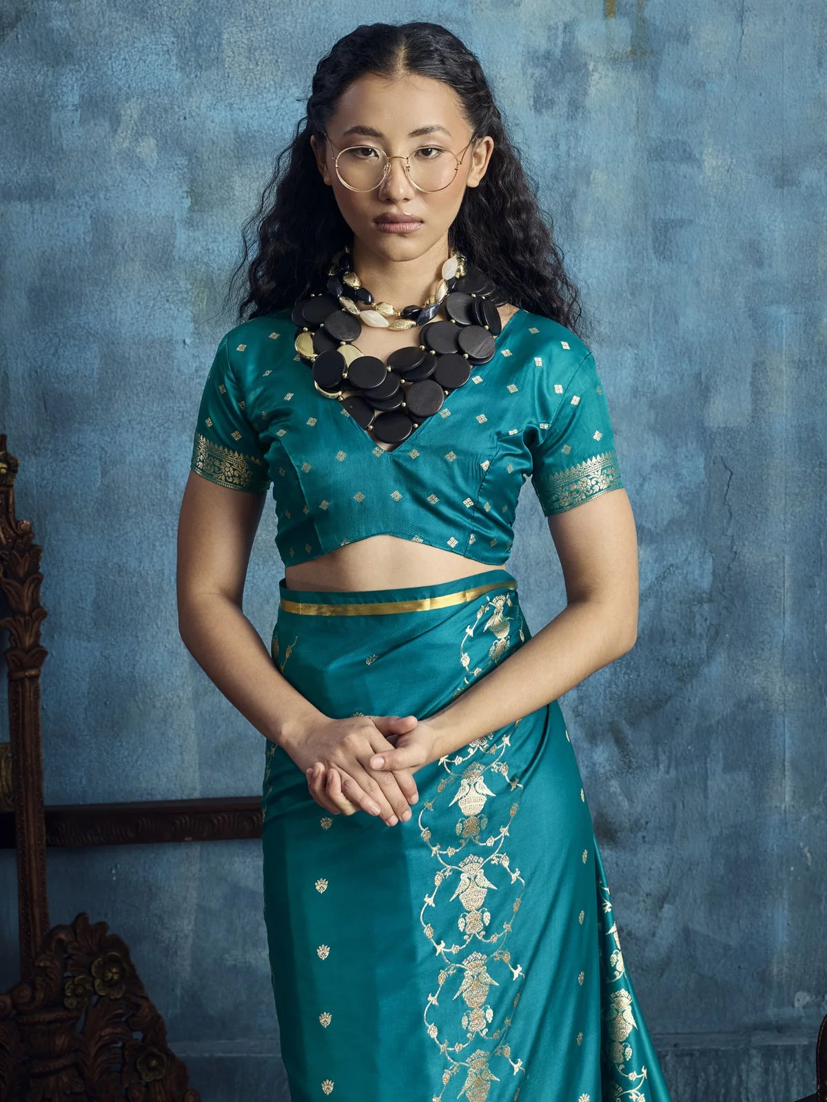 Tarani Dayita teal satin saree upper body view showcasing brocade blouse and delicate woven motifs