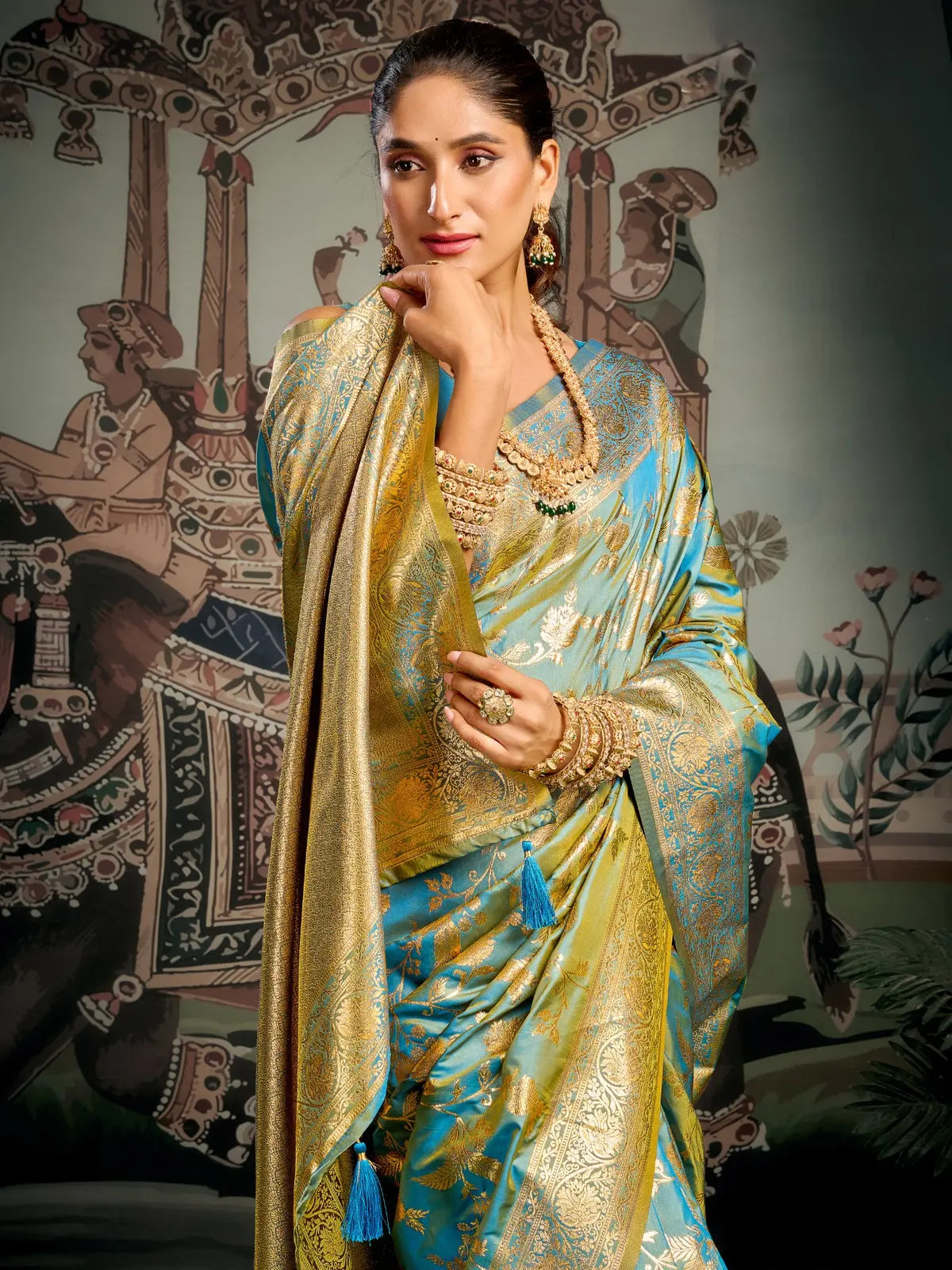 Tarani teal silk saree upper body view with jewelry styling for festive occasions