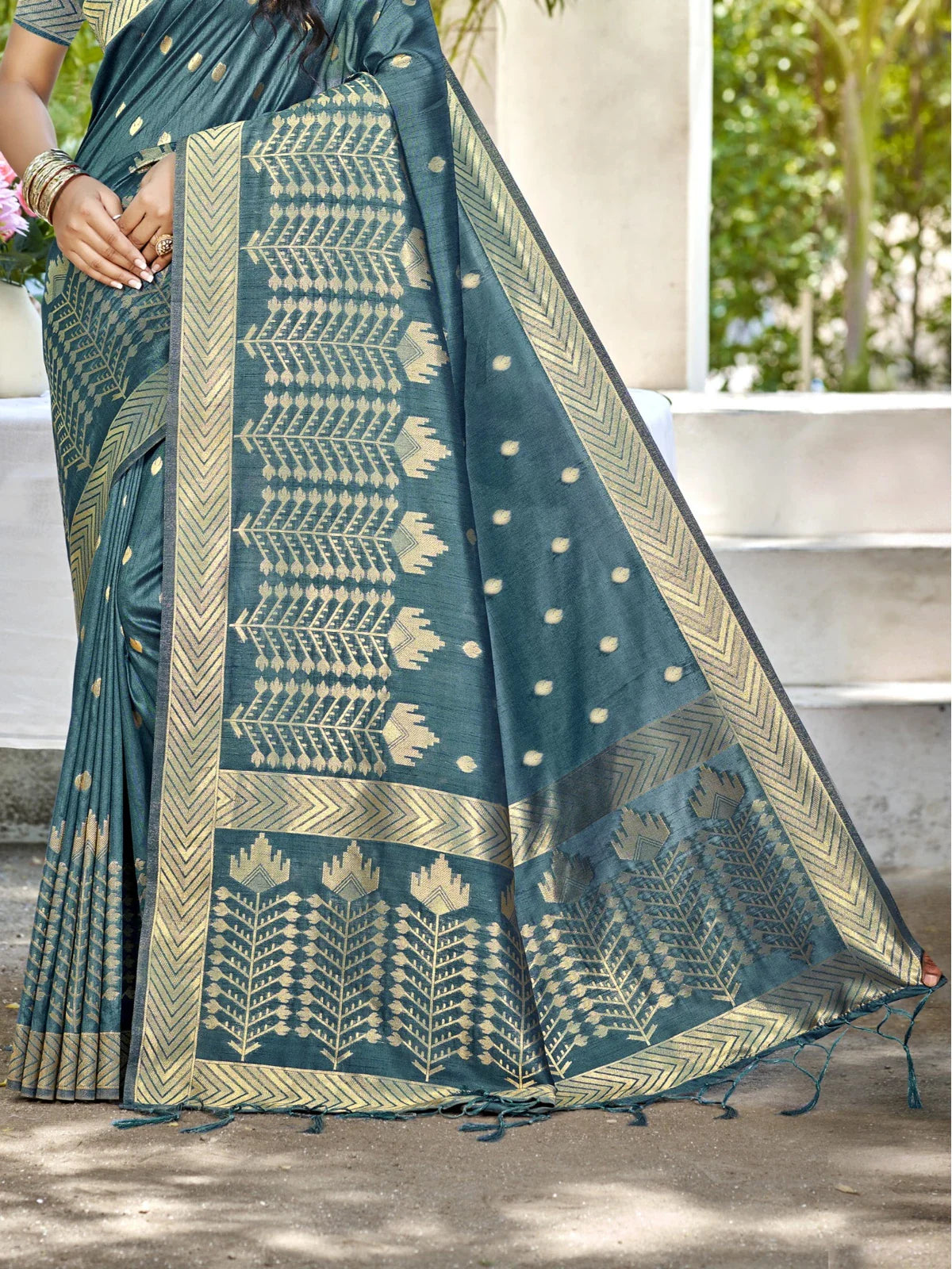 Tarani turquoise Assam silk saree closeup of pallu design and elegant woven patterns