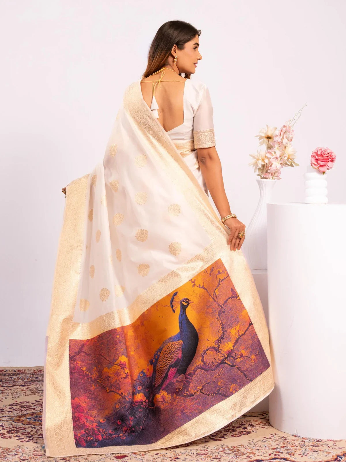 Tarani banarasi silk saree back view with full pallu peacock design in golden and purple tones