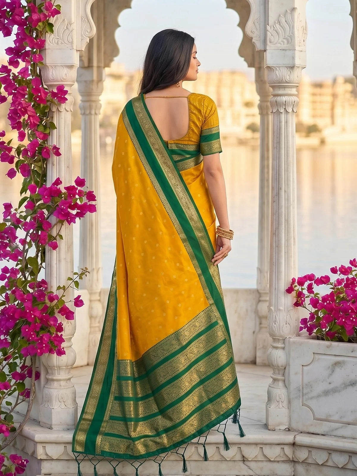Tarani yellow soft silk saree back view with rich green zari pallu and blouse detailing