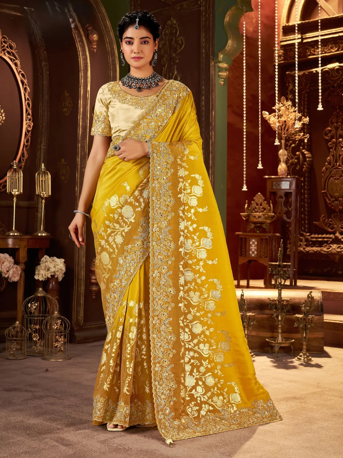 Tarani yellow silk saree full view with zari embroidery border and floral blouse for wedding wear