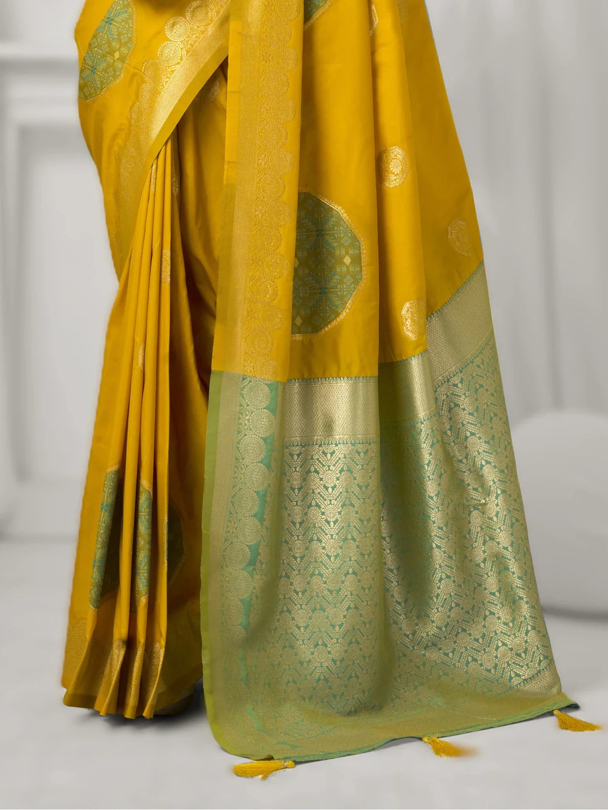 Tarani soft silk saree yellow pallu and intricate green zari border view
