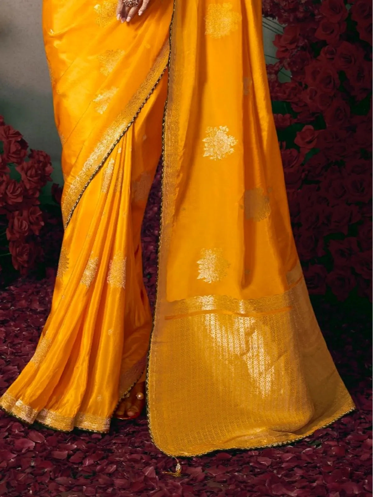 Tarani yellow silk saree pallu with golden zari border and woven floral motifs