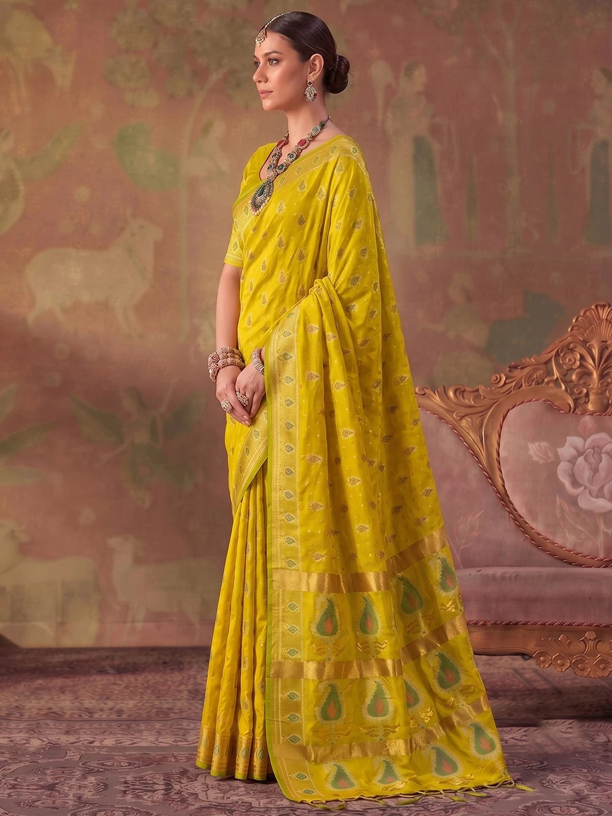 Tarani yellow silk saree with zari weaving side view showing elegant drape