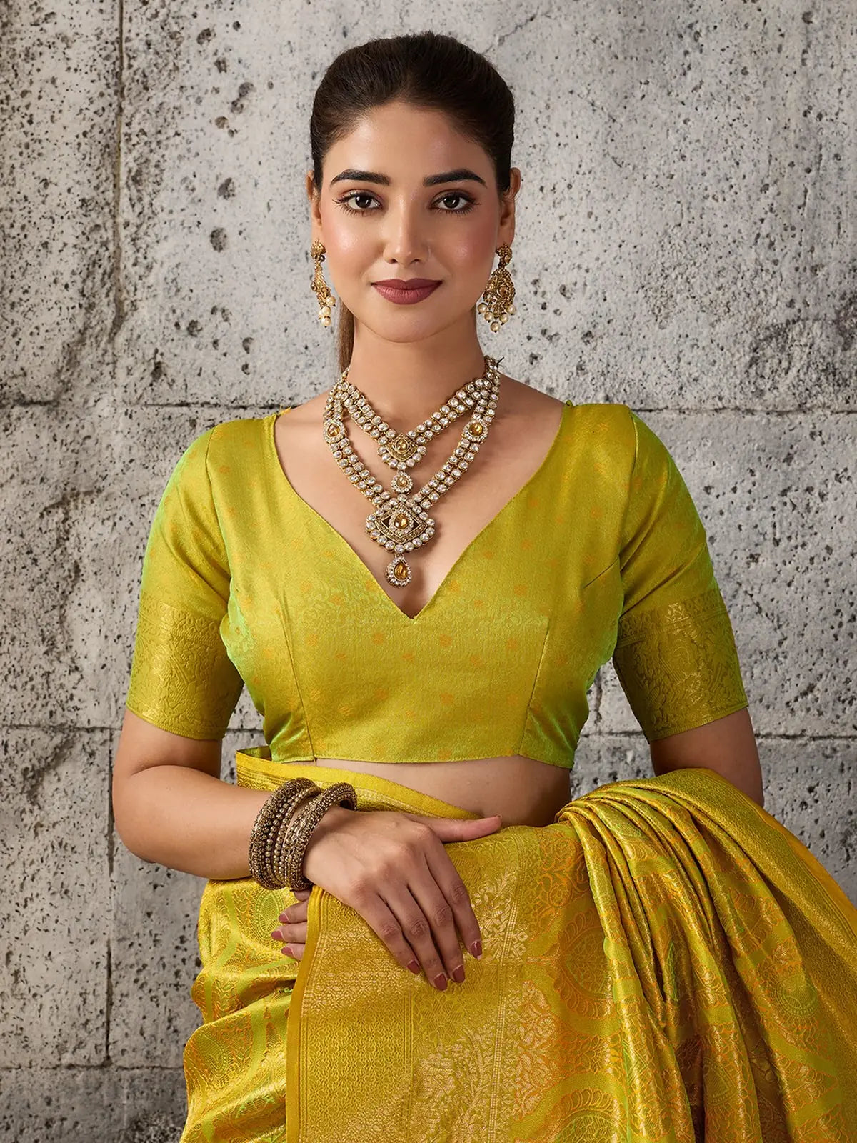 Tarani Rajvika yellow Kanjivaram silk blend saree upper body view with zari blouse and woven details