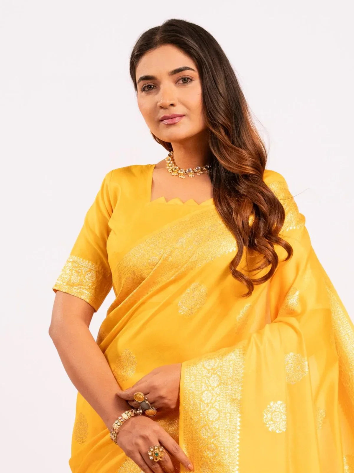 Tarani yellow saree soft silk upper-body view with elegant zari patterns and festive appeal