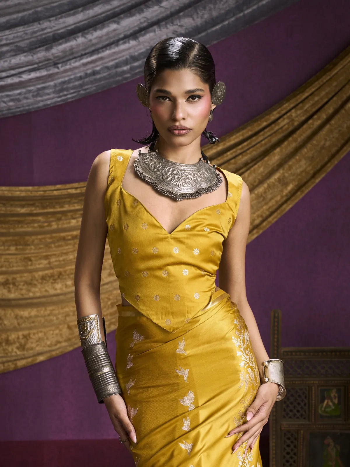 Tarani yellow silk saree upper-body closeup with elegant neckline and blouse style