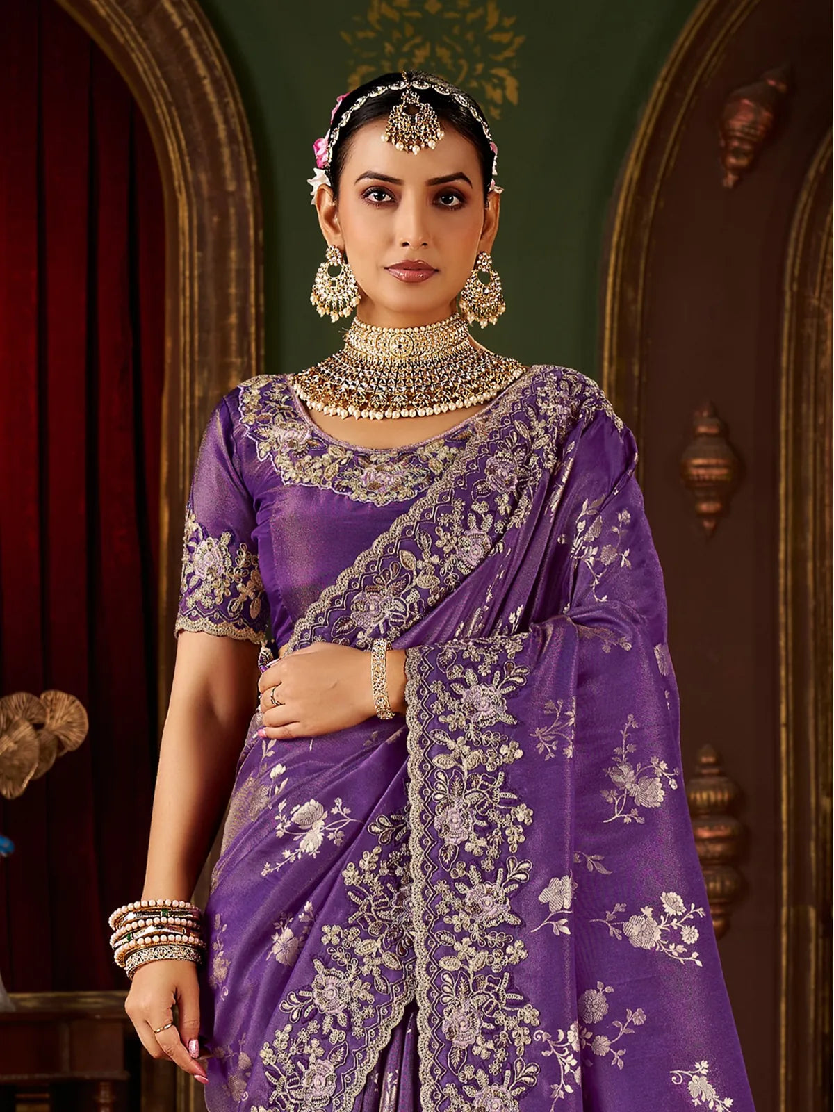 Tarani purple fancy saree with zari embroidered blouse upper body closeup front view