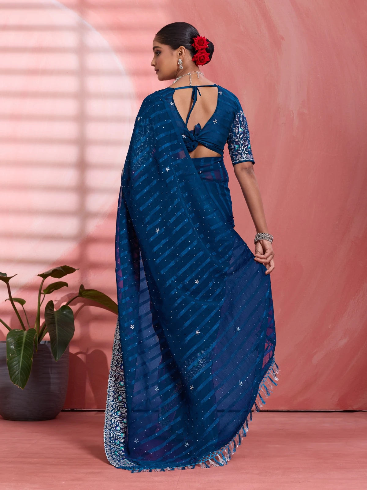 Tarani navy blue solo chiffon saree back view with stylish blouse pattern and flowing festive drape