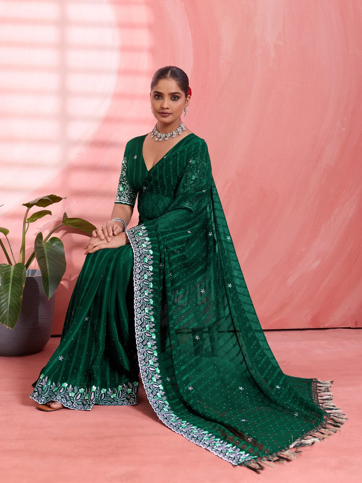 Tarani green solo chiffon saree pallu view with striped design and tassel border