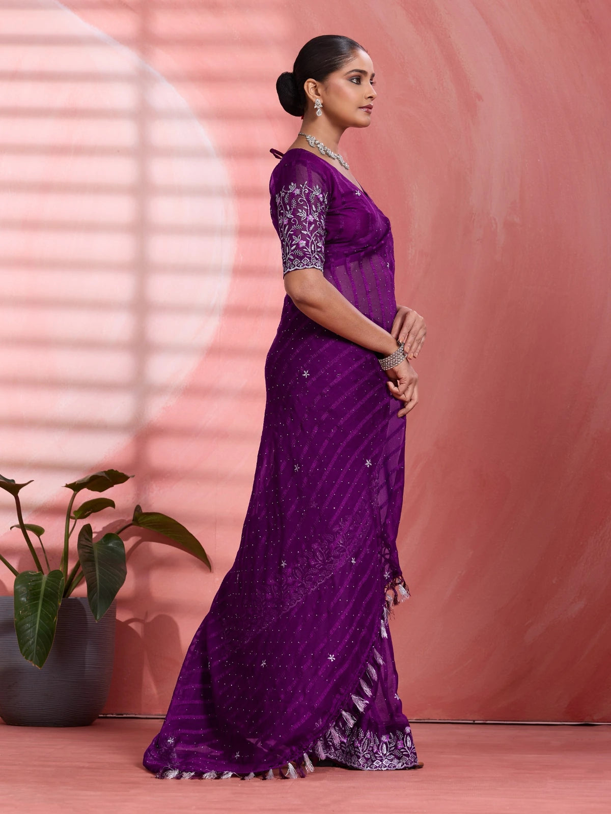 Tarani purple chiffon saree side view with elegant drape and silver border work