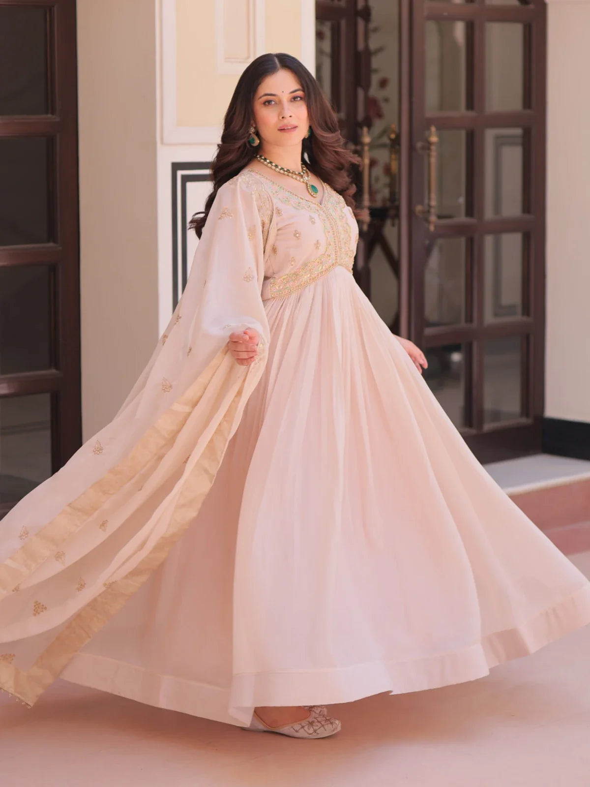 Tarani beige star georgette front view gown with flowing flare and dupatta